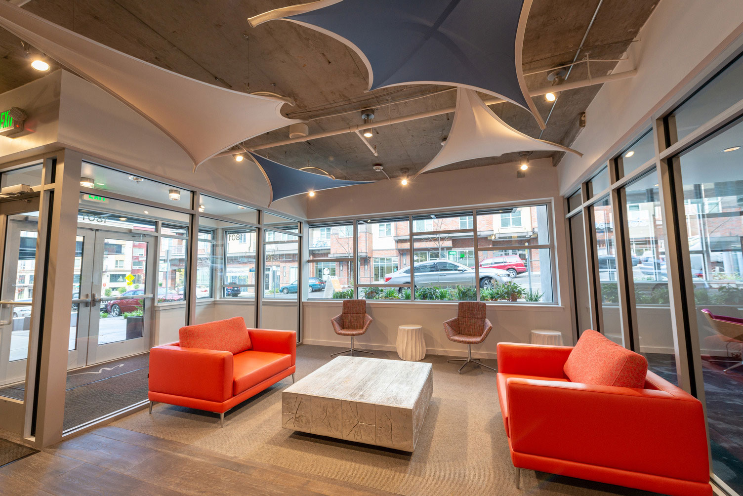 Clubhouse lounge interior with couch and chair seating