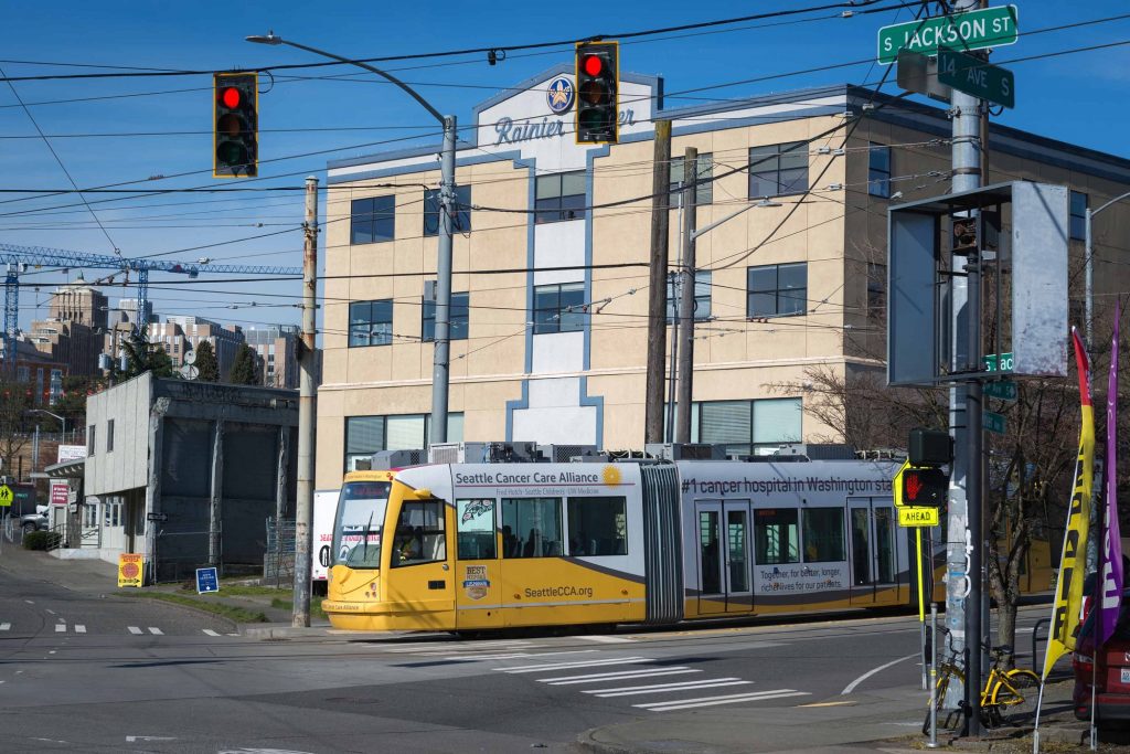 Trolley train stopped at Jackson and Avenue Street intersection with passengers